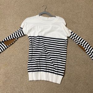 Pink blush, medium white sweater